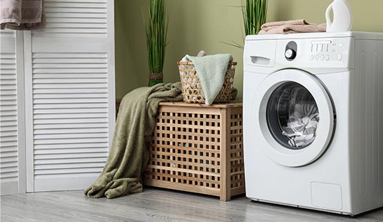 home laundry room with modern washing machine