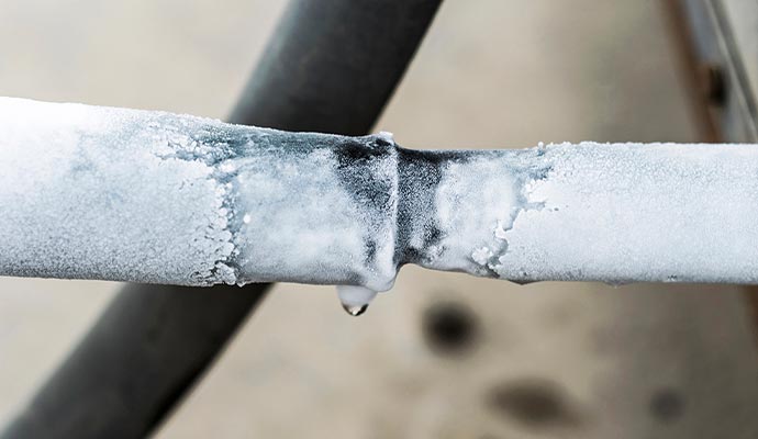pipes covered by snow or frozen