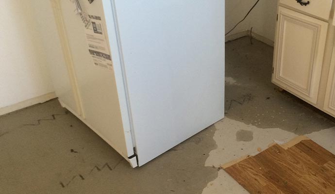 refrigerator leak water damage floor