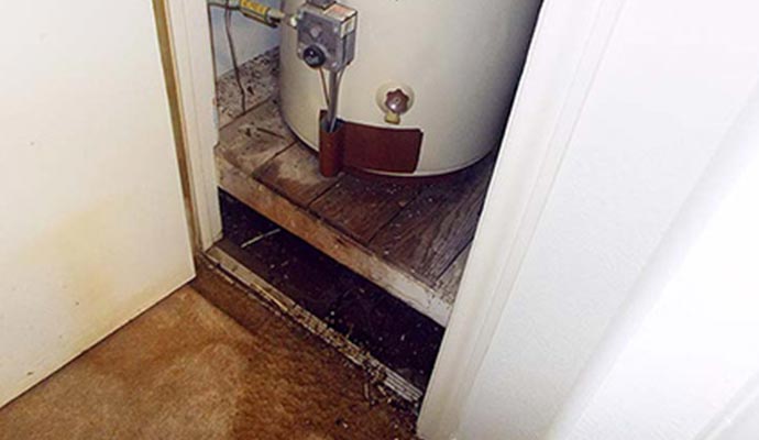 water heater flooding appliance leak cleanup